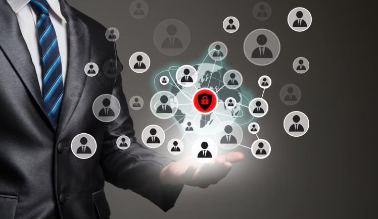 Businessman holding digital network with security symbol.