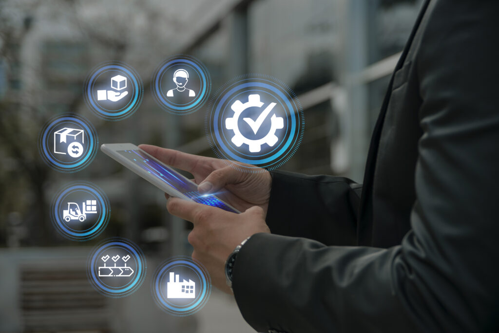 Person using smartphone with logistics icons overlay.