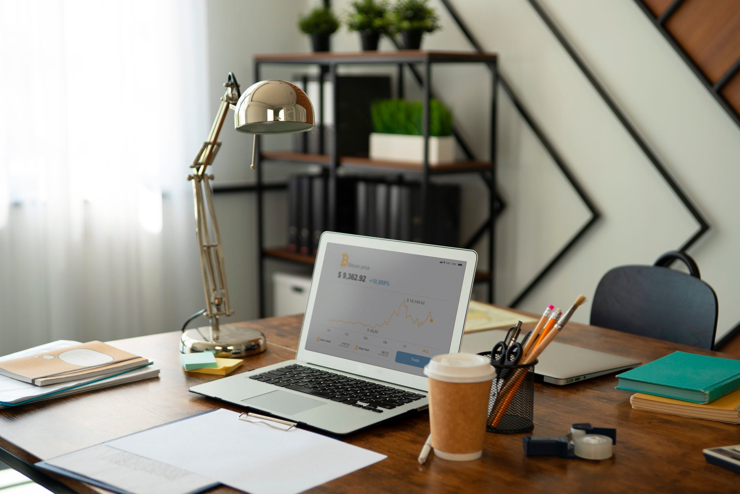 Home office desk with laptop and coffee
