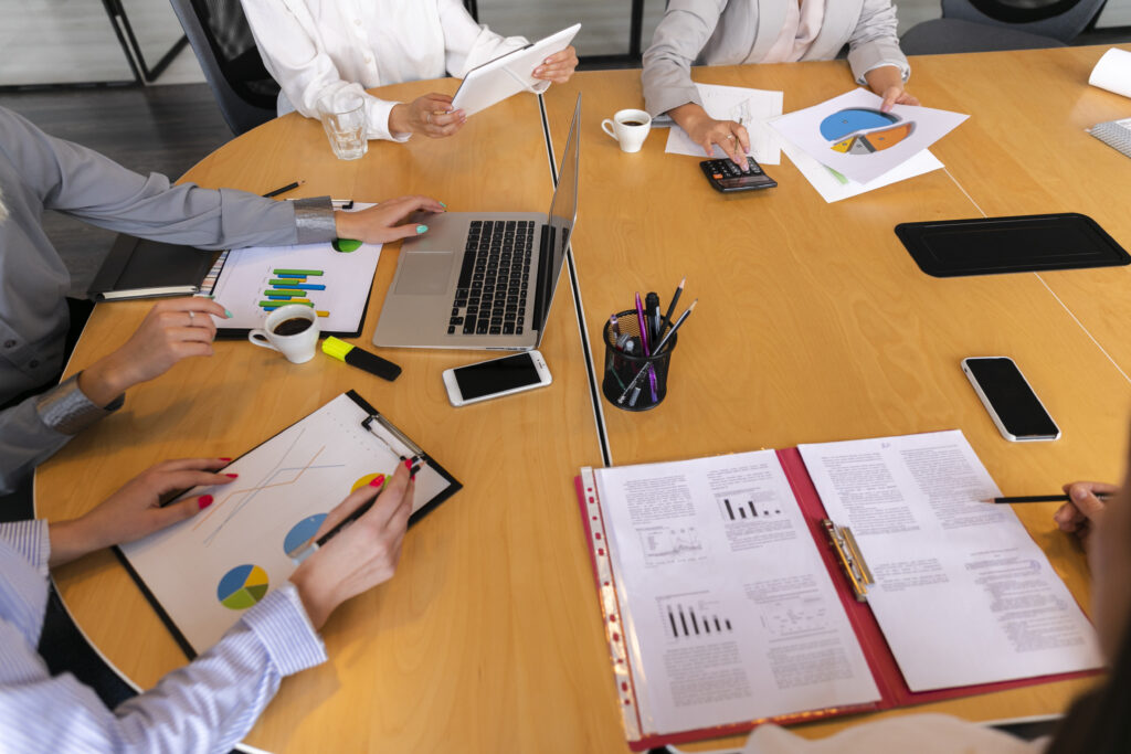 Team meeting discussing financial charts and graphs.